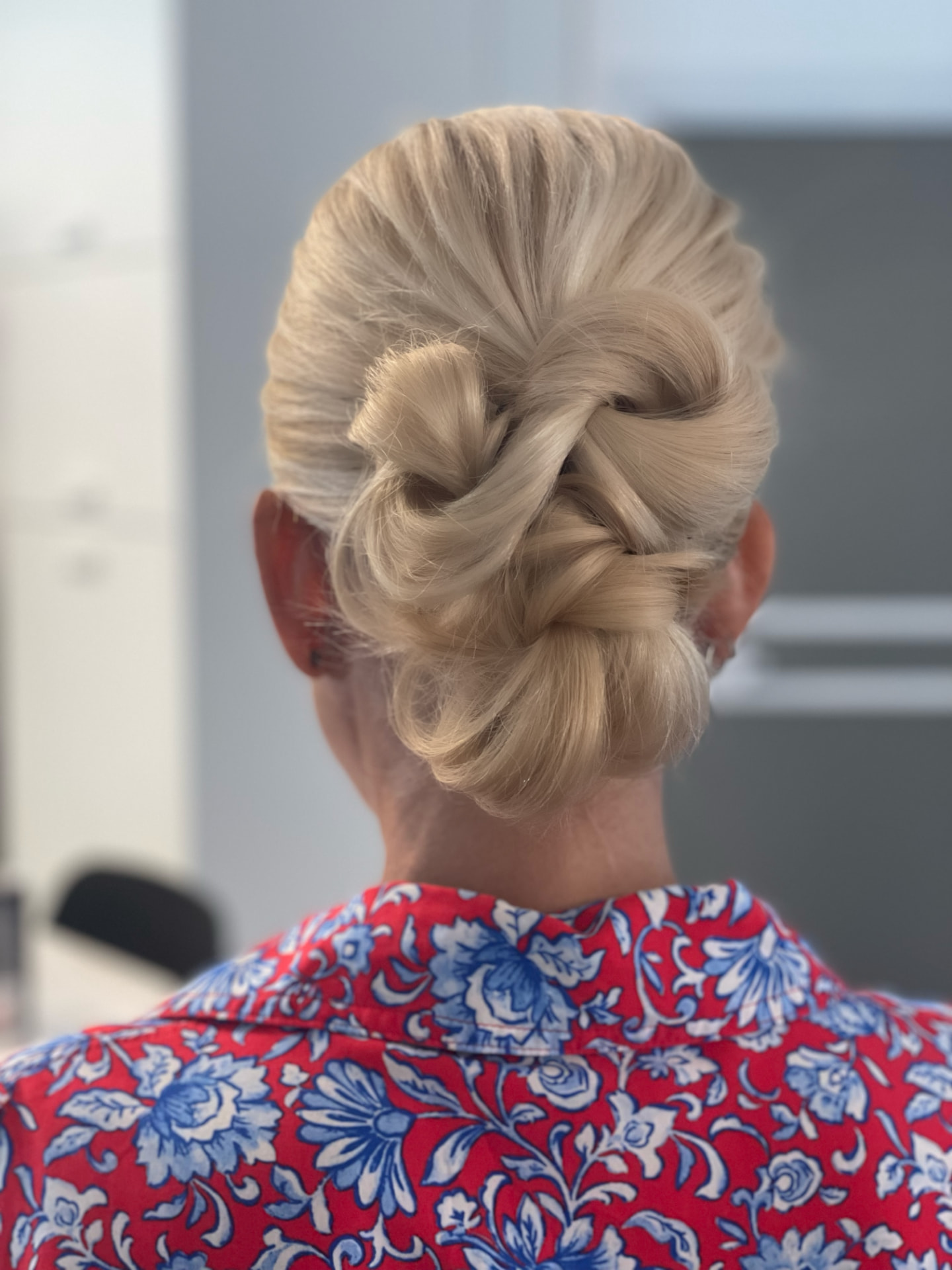 Bridal look by Lee Elrom — blonde twist bun with soft glam makeup