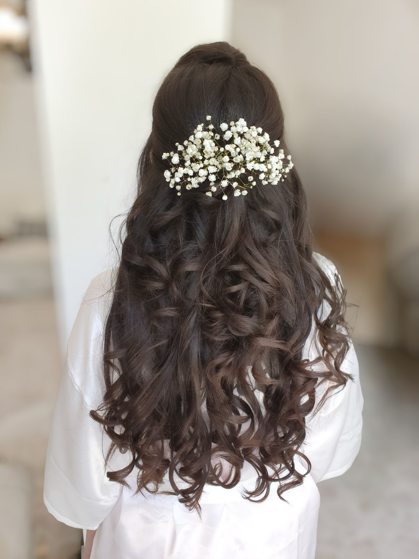 Bridal look by Lee Elrom — half-up half-down style with baby's breath
